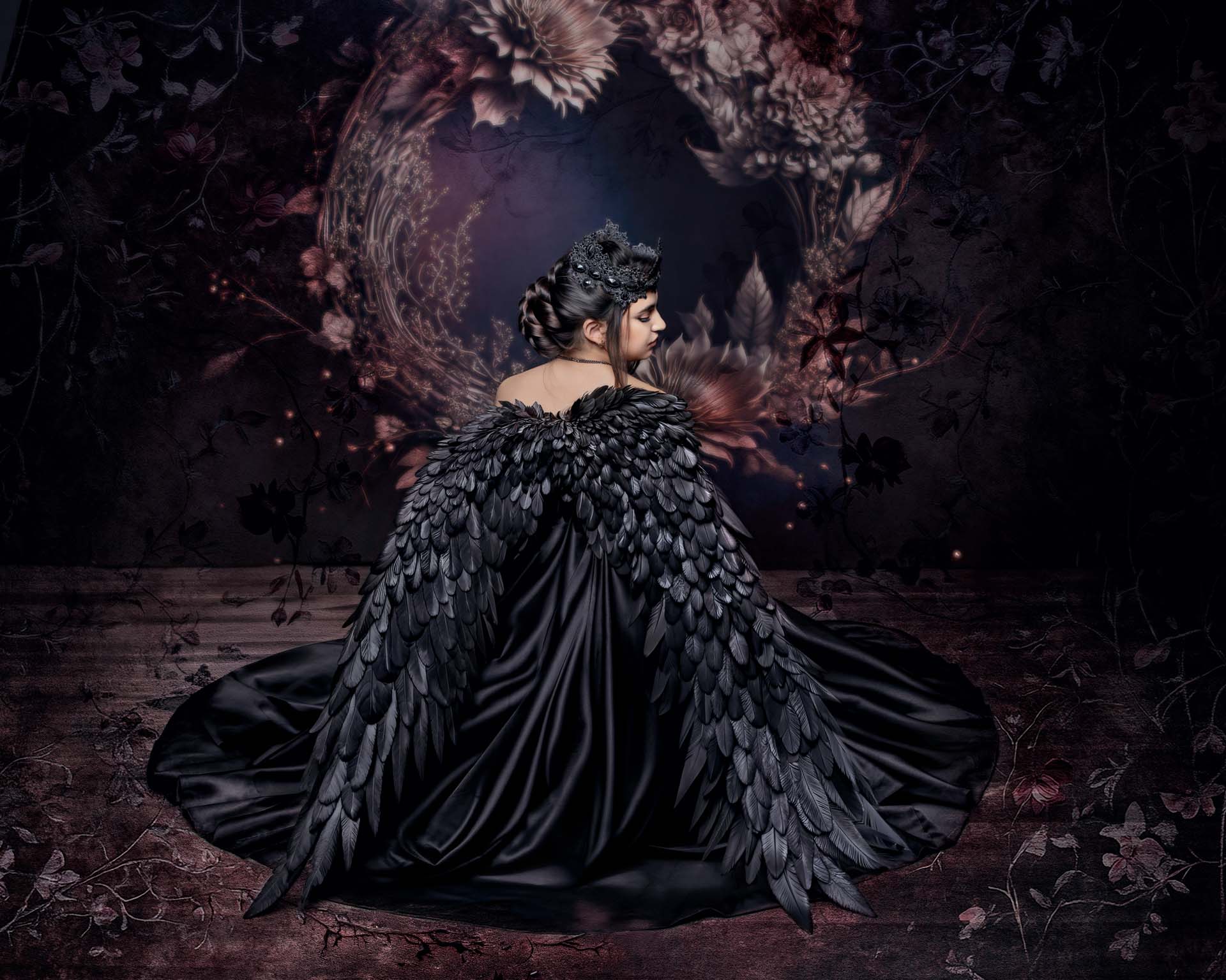 Une jeune fille assise au sol.